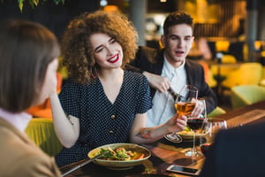 group-friends-eating-restaurant-scaled-1